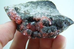 Rhodochrosite crystals with Smoky Quartz on Rhyolite from Peru